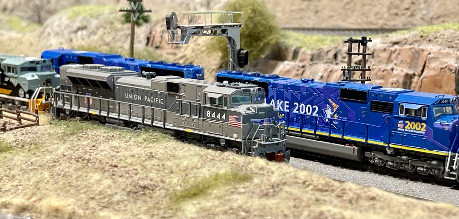 Blue Montana Rail Link diesels rounding a mountain curve