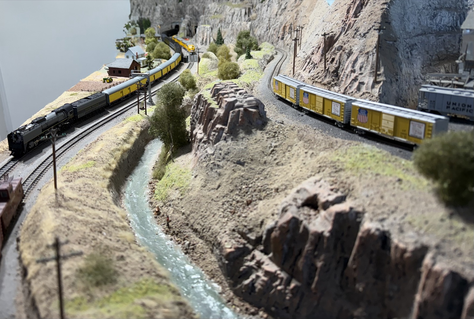 Aerial view of a train threading the canyon layout