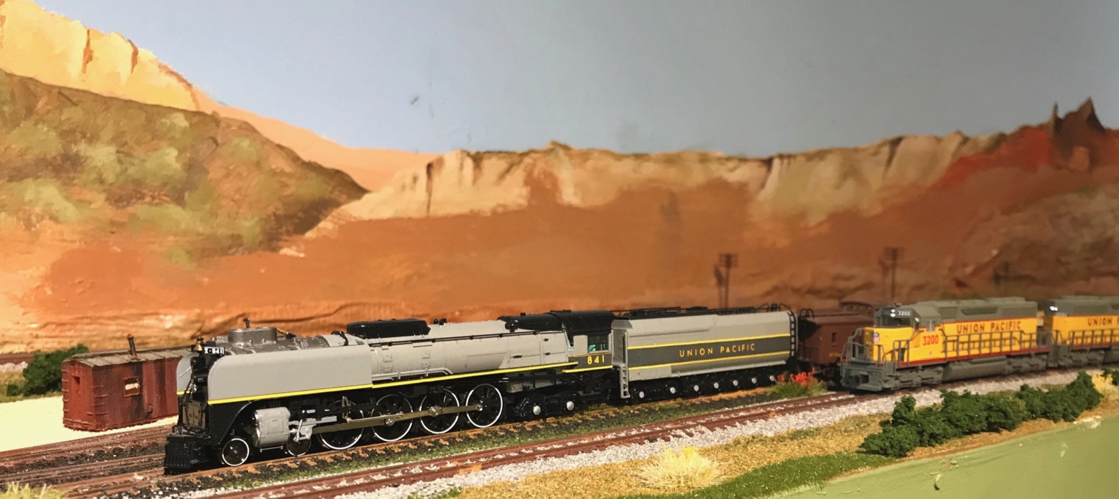 Long train crossing a sweeping desert landscape